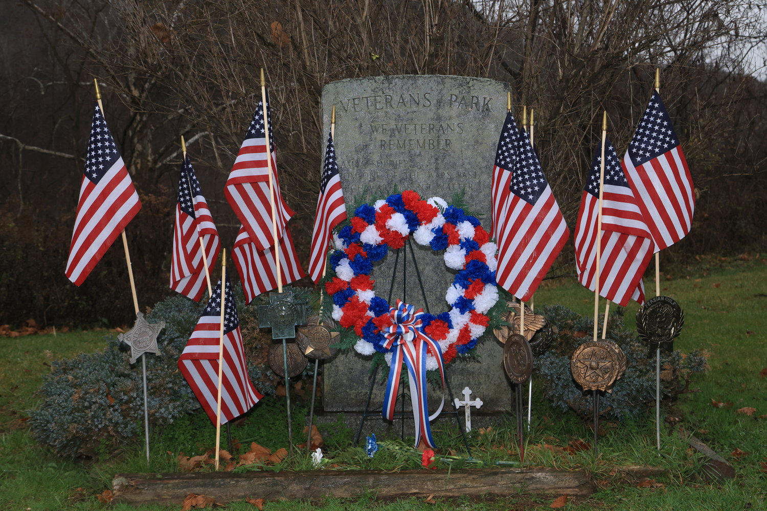 The Veterans Memorial Monument, with flags and a Veterans Day wreath, at Veterans Park, Fair Avenue, in Honesdale, PA, near the pool.